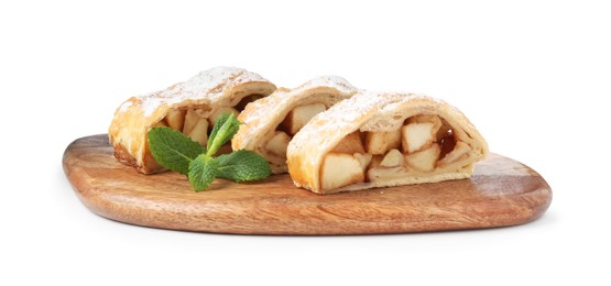 Photo of Pieces of tasty apple strudel with powdered sugar and mint isolated on white