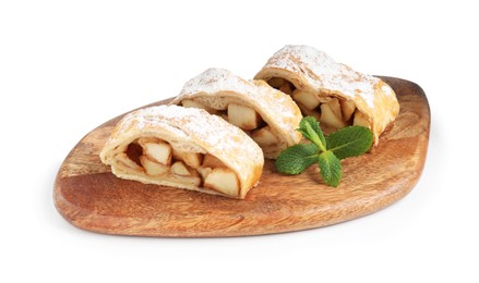 Photo of Pieces of tasty apple strudel with powdered sugar and mint isolated on white