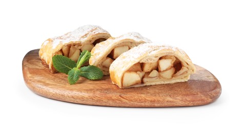 Photo of Pieces of tasty apple strudel with powdered sugar and mint isolated on white