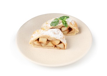 Photo of Pieces of tasty apple strudel with powdered sugar and mint isolated on white