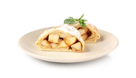 Photo of Pieces of tasty apple strudel with powdered sugar and mint isolated on white