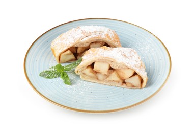 Photo of Pieces of tasty apple strudel with powdered sugar and mint isolated on white