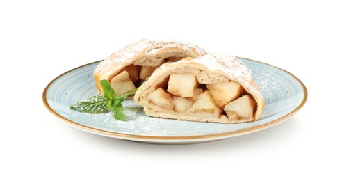 Photo of Pieces of tasty apple strudel with powdered sugar and mint isolated on white