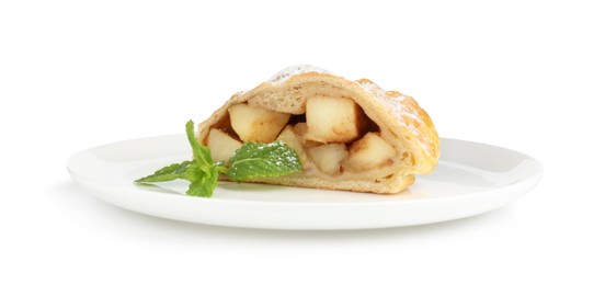 Photo of Piece of tasty apple strudel with powdered sugar and mint isolated on white