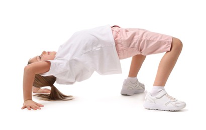 Photo of Cute little girl exercising on white background