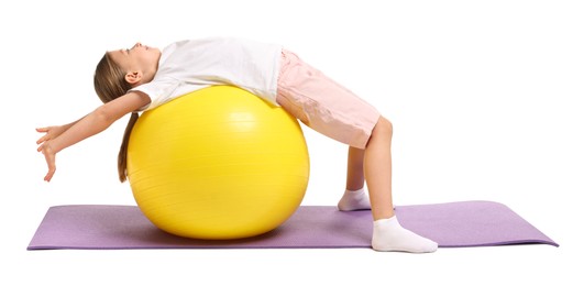 Photo of Cute little girl with fitness ball on white background