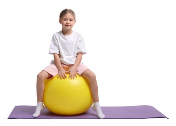 Cute little girl with fitness ball on white background, space for text