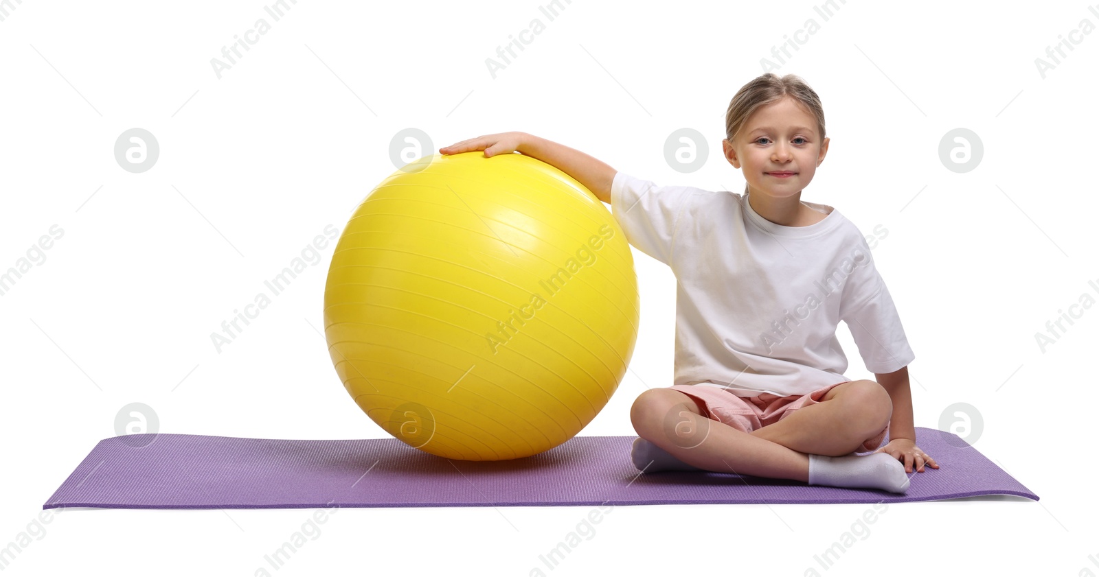 Photo of Cute little girl with fitness ball on white background