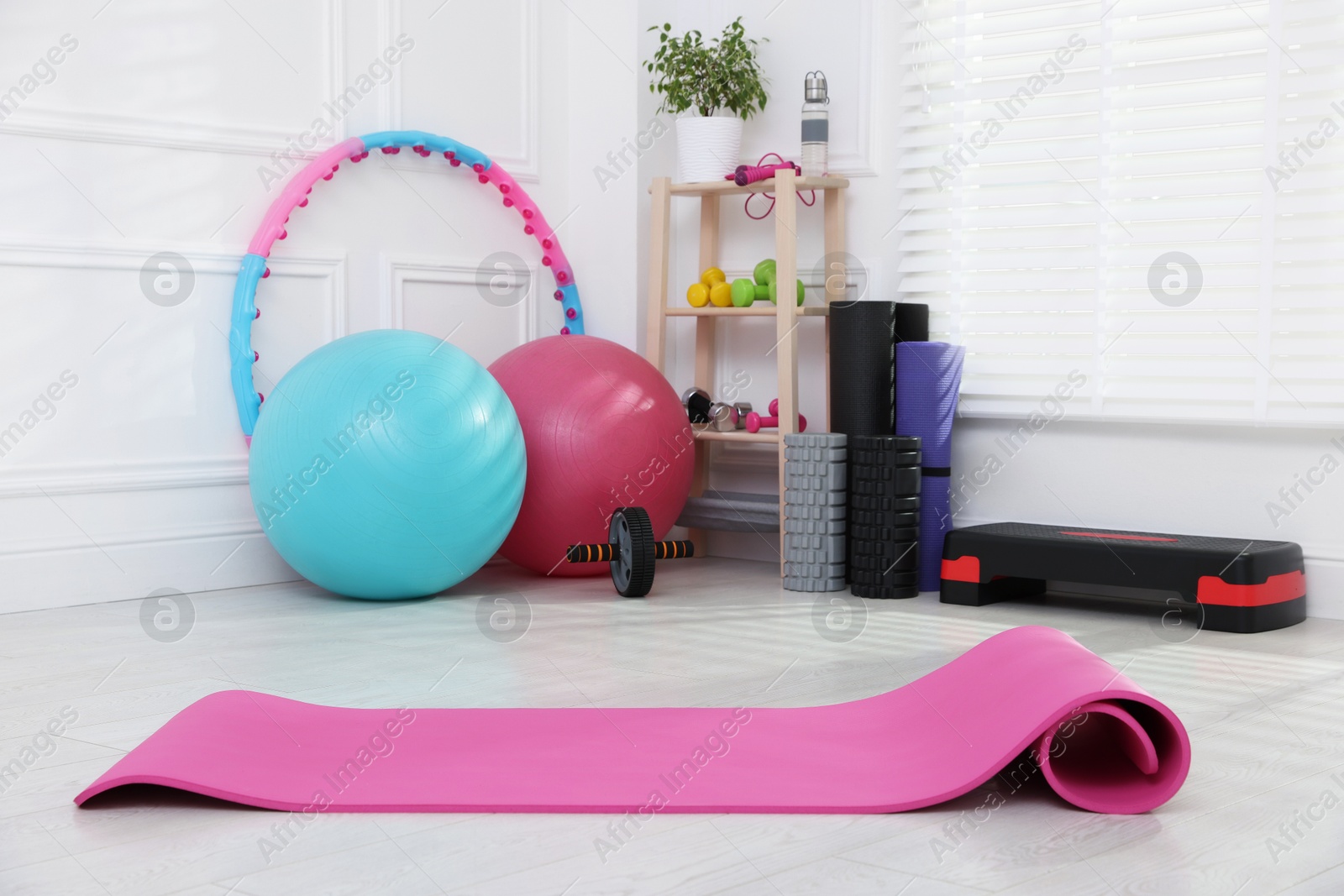 Photo of Many different fitness equipment and accessories indoors