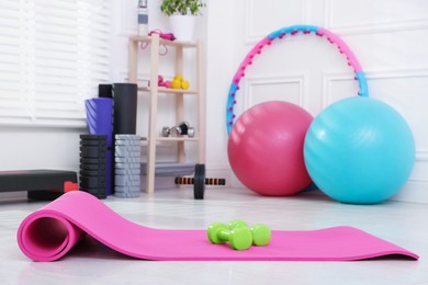 Photo of Many different fitness equipment and accessories indoors