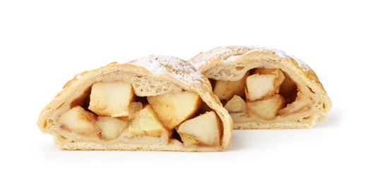 Photo of Pieces of tasty apple strudel with powdered sugar isolated on white