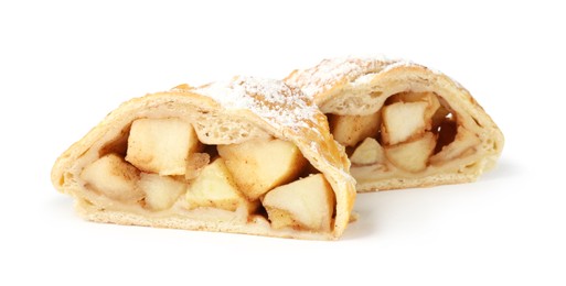 Photo of Pieces of tasty apple strudel with powdered sugar isolated on white