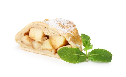 Photo of Piece of tasty apple strudel with powdered sugar and mint isolated on white