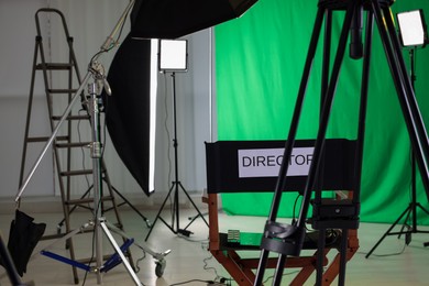 Chair with word Director and professional equipment in modern film studio