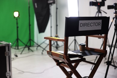 Chair with word Director and professional equipment in modern film studio