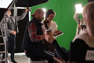 Group of people working in modern film studio