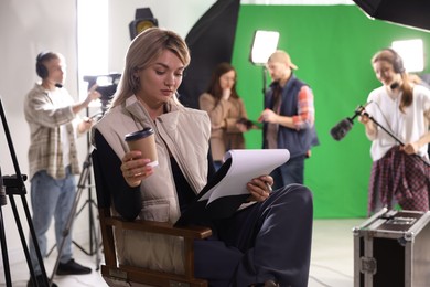 Photo of Group of people working in modern film studio