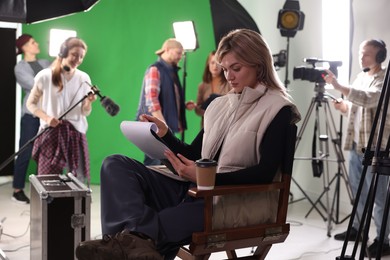 Group of people working in modern film studio