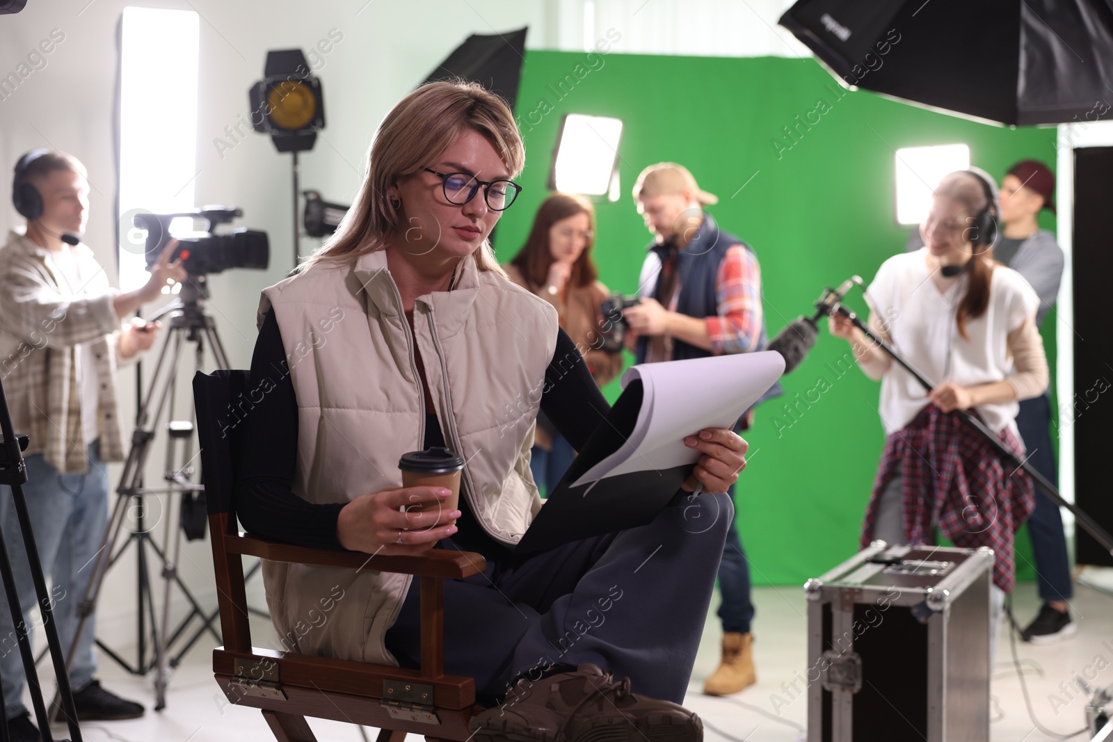 Photo of Group of people working in modern film studio