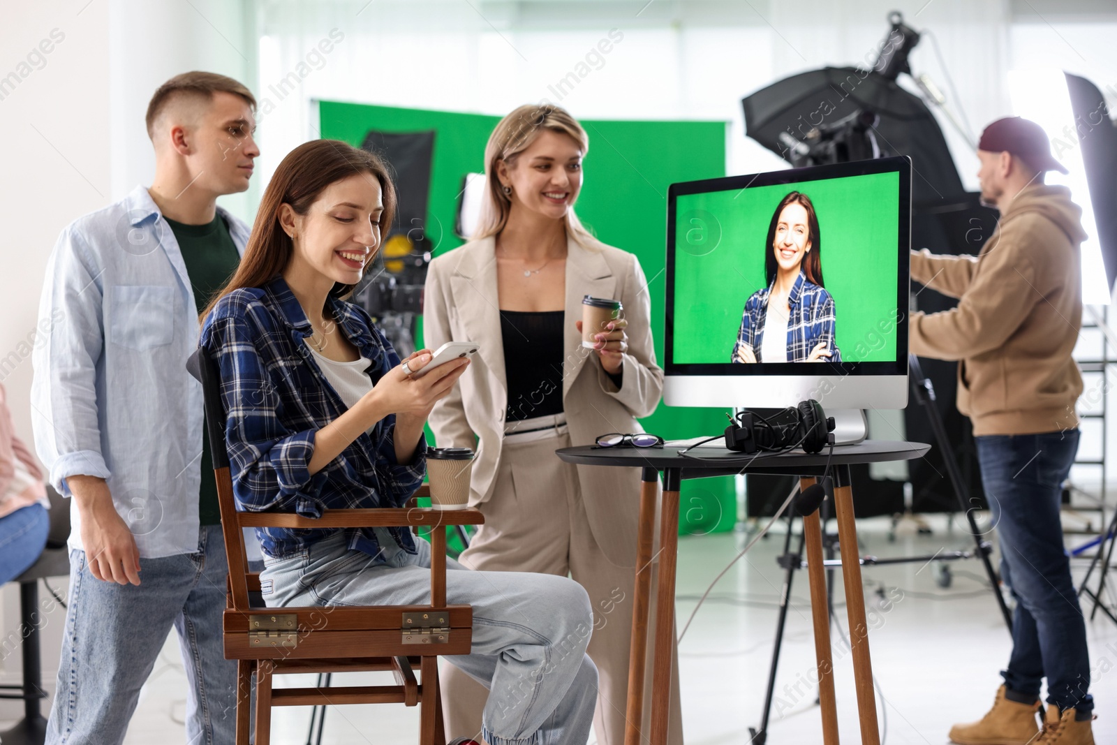 Photo of Group of people working in modern film studio