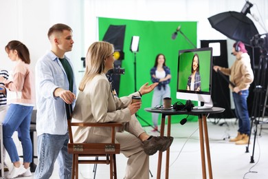 Group of people working in modern film studio