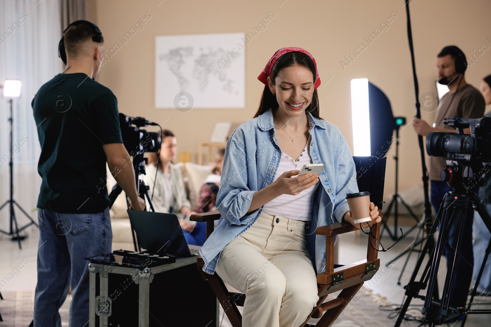 Photo of Group of people working in modern film studio