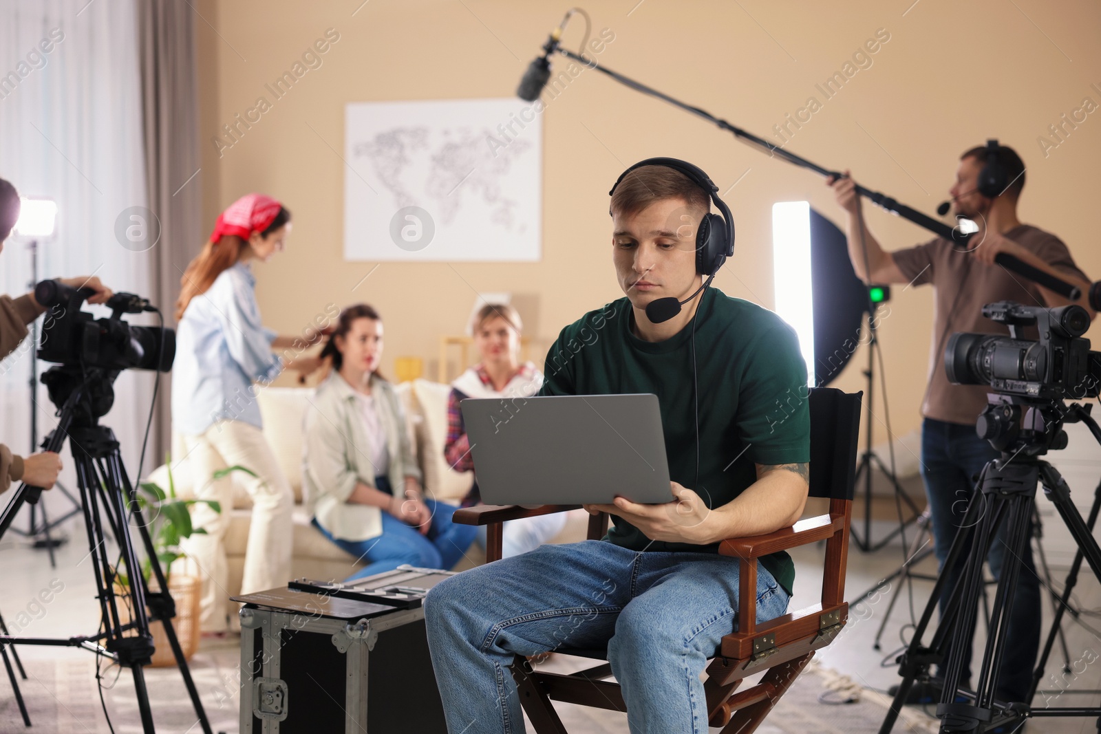 Photo of Group of people working in modern film studio