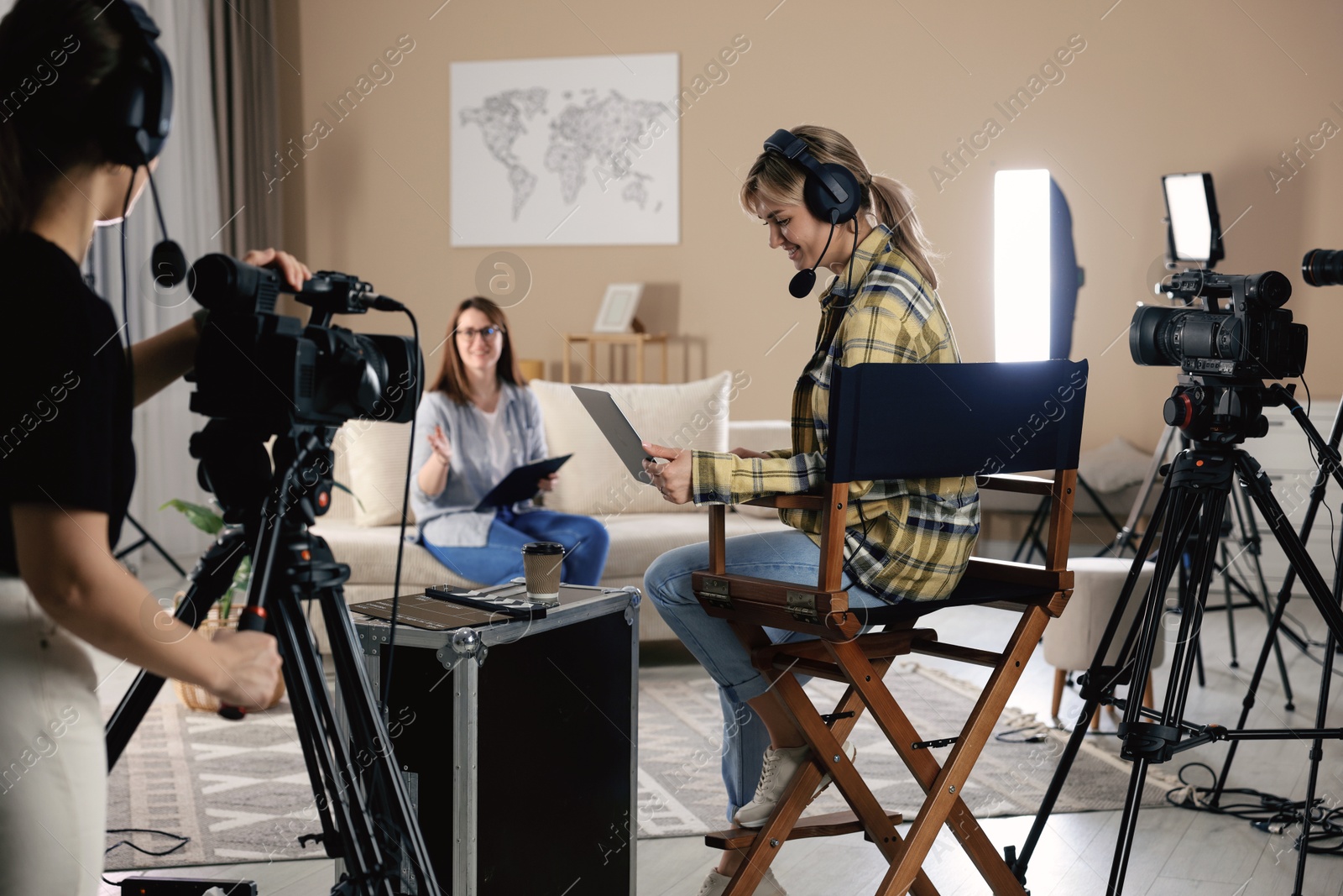 Photo of Group of people working in modern film studio