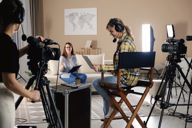 Group of people working in modern film studio