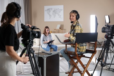 Group of people working in modern film studio