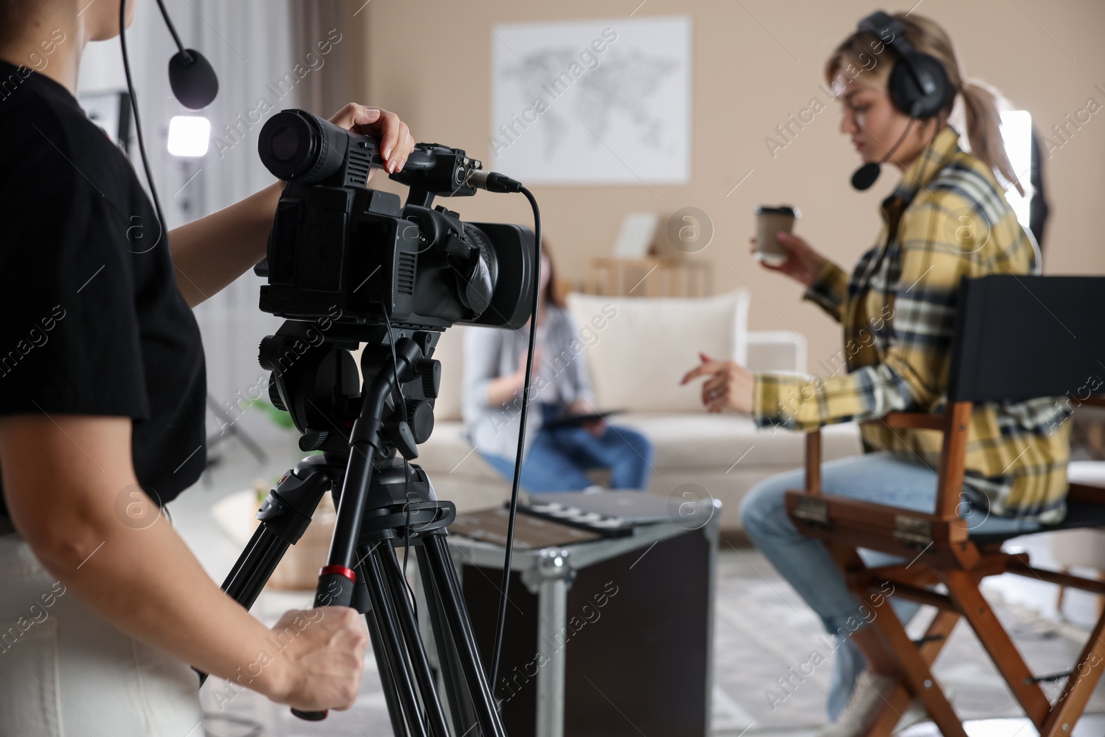 Photo of Group of people working in modern film studio, selective focus