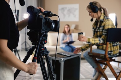 Photo of Group of people working in modern film studio, selective focus