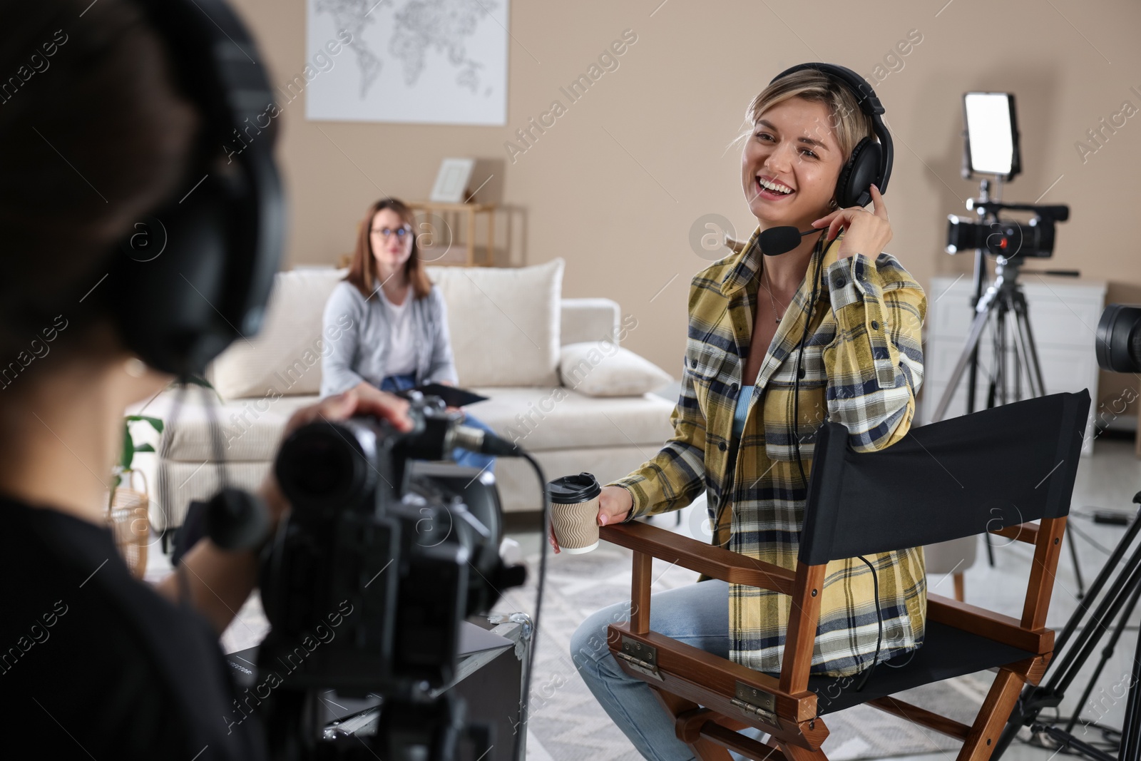 Photo of Group of people working in modern film studio