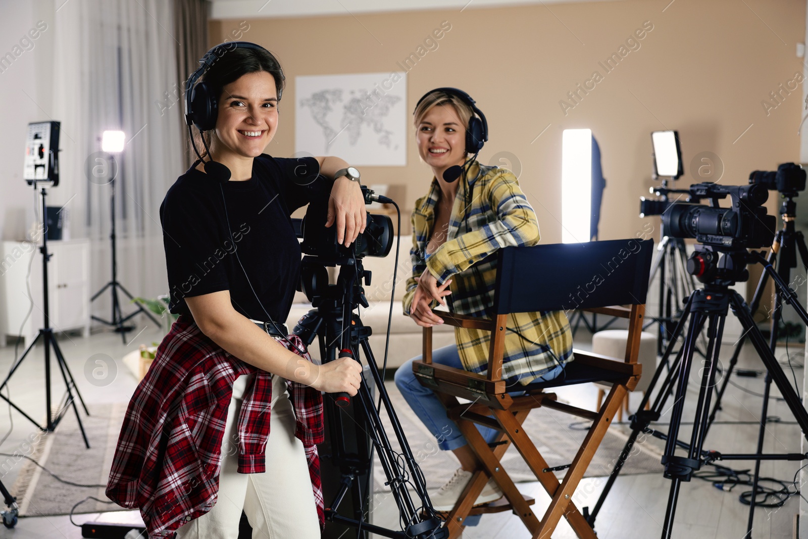 Photo of Young women working in modern film studio