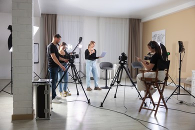 Group of people working in modern professional film studio