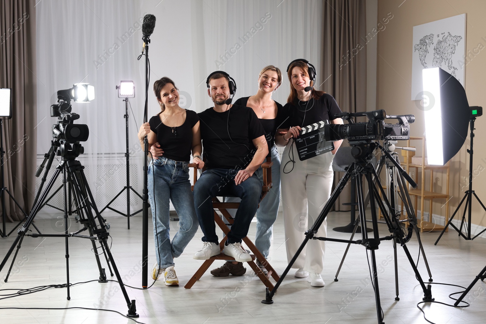 Photo of Group of people working in modern professional film studio