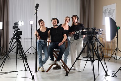 Group of people working in modern professional film studio