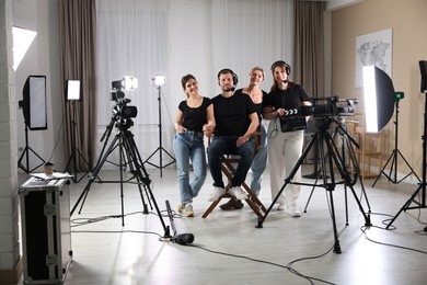 Group of people working in modern professional film studio