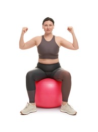 Photo of Plus size woman in gym clothes with fitness ball on white background