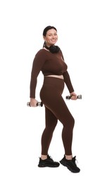 Photo of Plus size woman in gym clothes doing exercise with dumbbells on white background