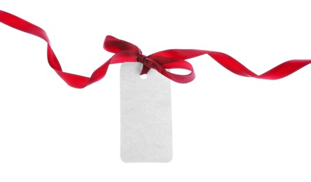 Photo of Blank tag with red ribbon bow isolated on white