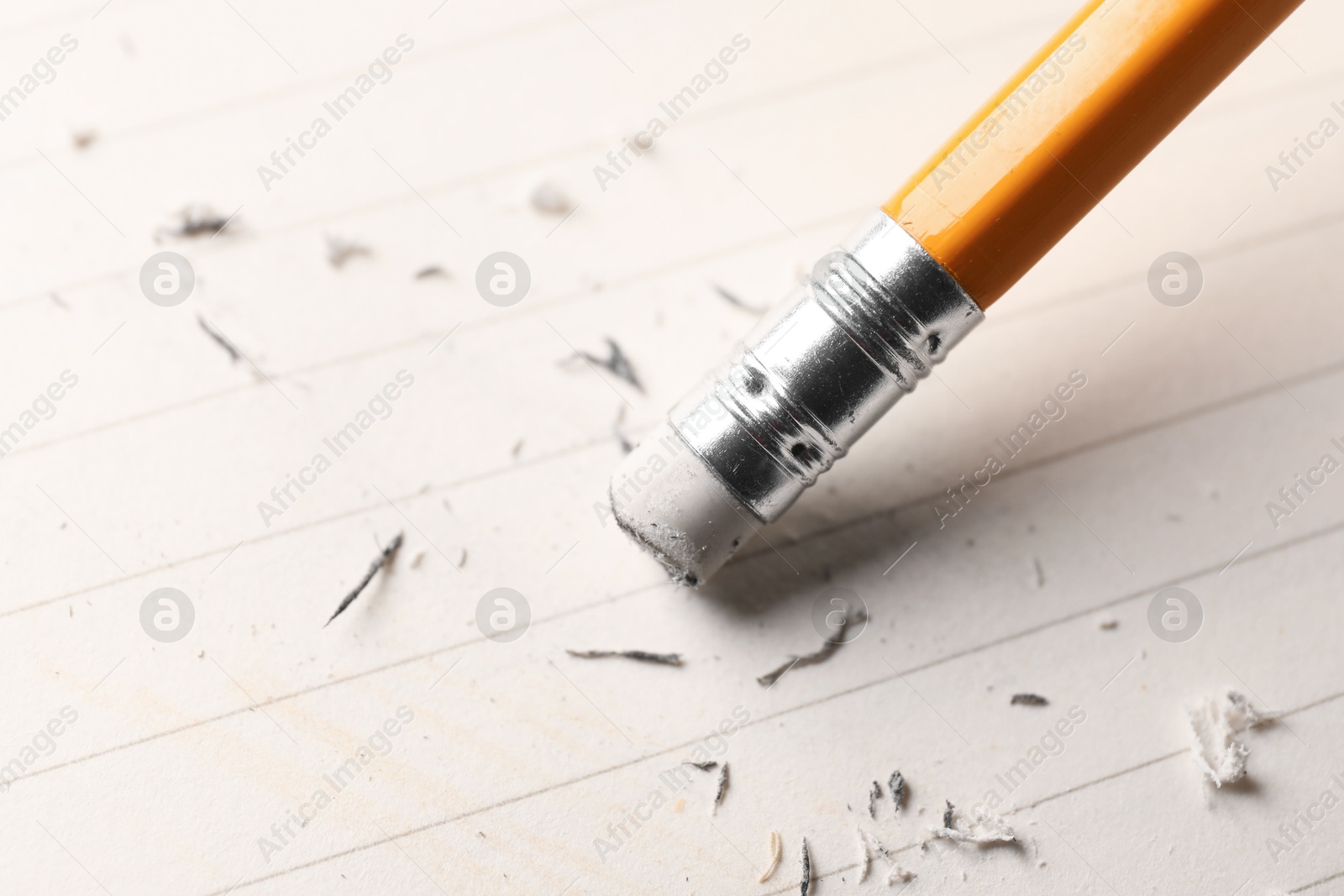 Using pencil with eraser on white sheet of paper, closeup Photo of Using pencil with eraser on white sheet of paper, closeup