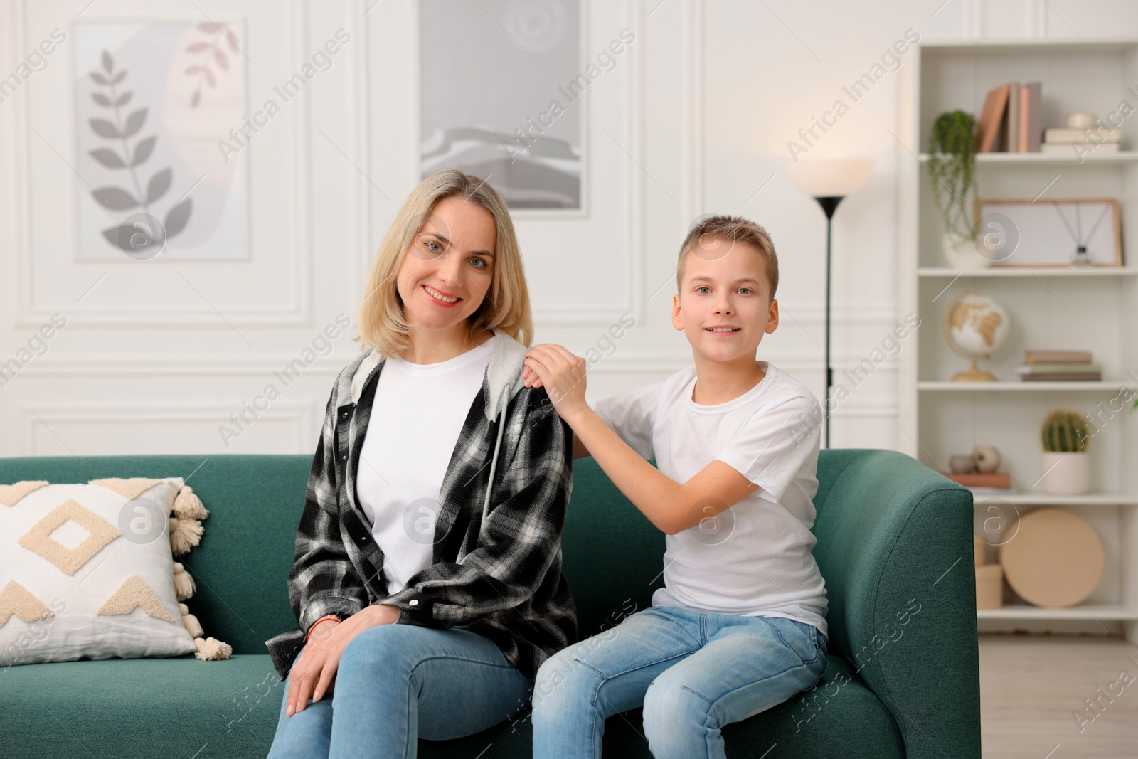 Photo of Mother and son on sofa at home