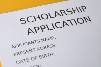 Photo of Scholarship application form on table, closeup view