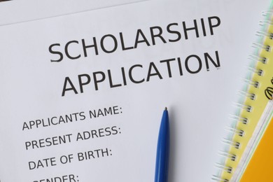 Photo of Pen on scholarship application form, top view