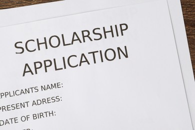 Scholarship application form on table, top view