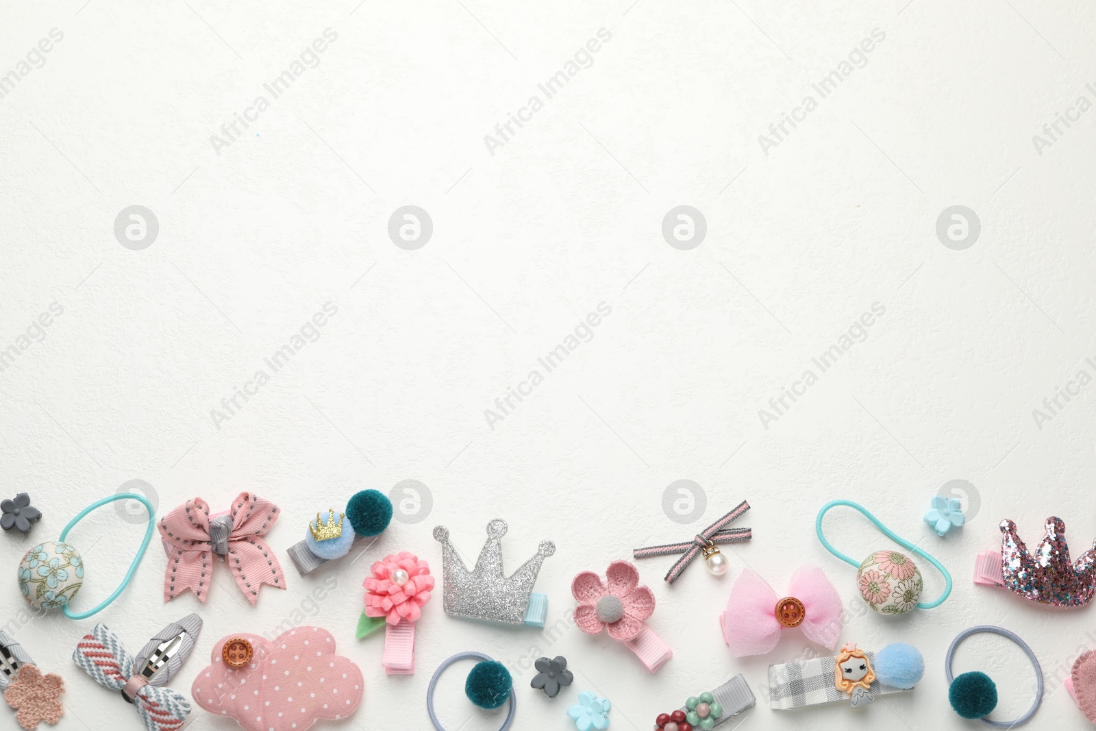 Photo of Different hair accessories on white table, flat lay. Space for text