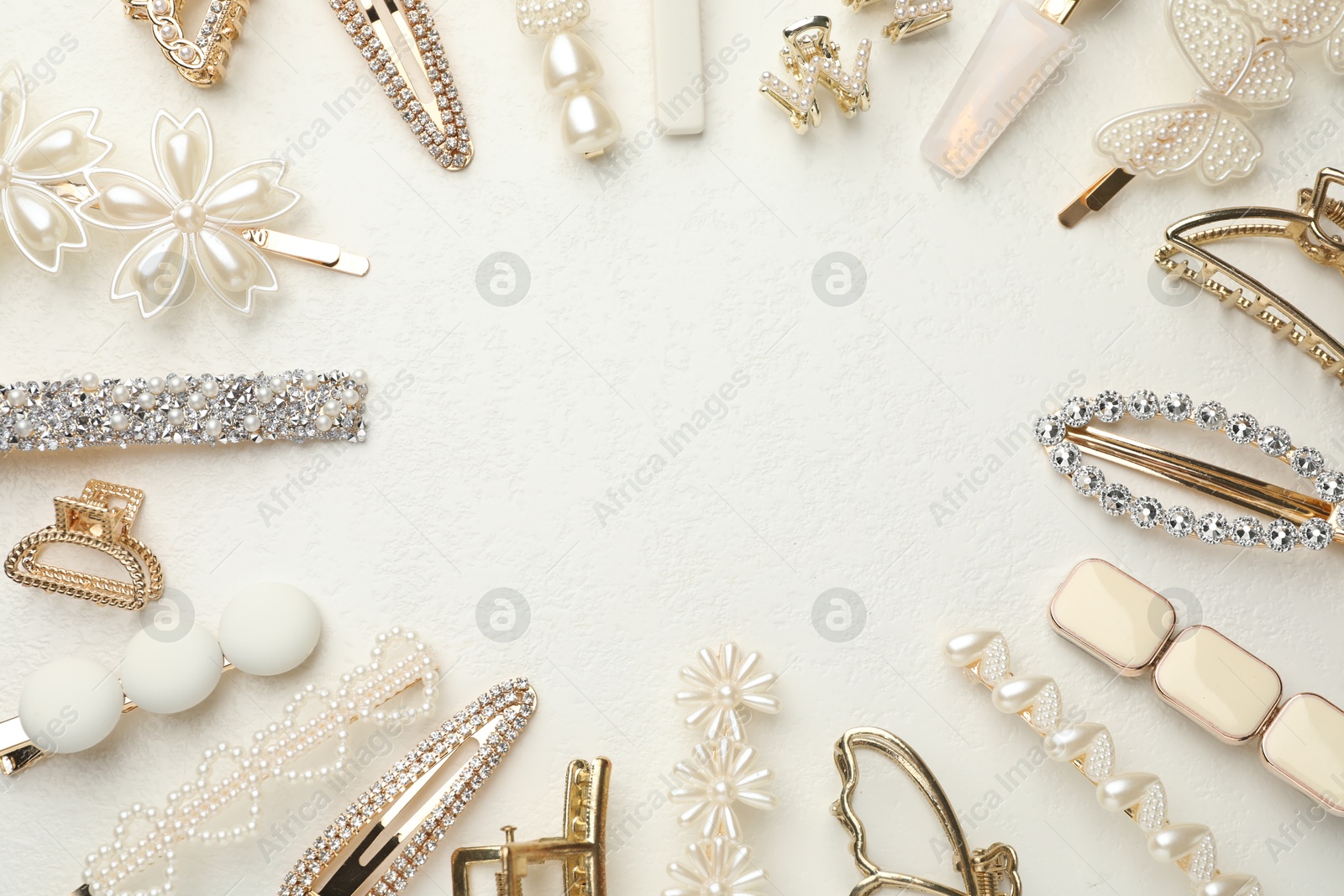 Photo of Frame of different hair accessories on white table, flat lay. Space for text