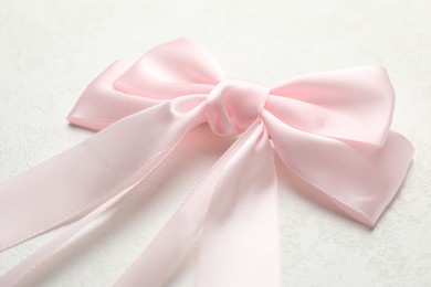 Beautiful hair bow on white table, closeup