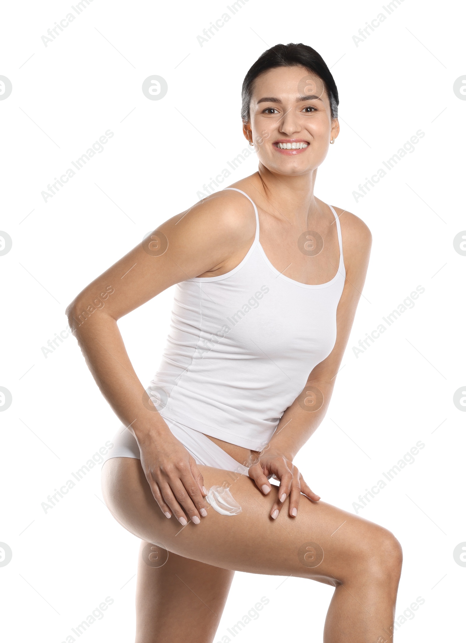 Photo of Woman applying anti cellulite cream on white background